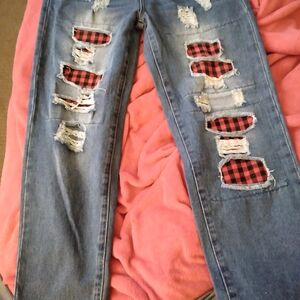 Trendy Distressed Jeans with Plaid Accents